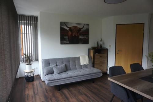 a living room with a couch and a table at Ferienwohnung Heidi in Mariapfarr