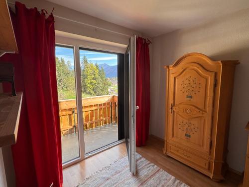 a room with a door and a view of a balcony at Haus König in Kirchbach