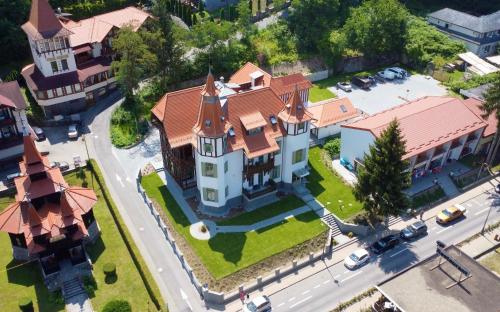 an overhead view of a large house with turrets at Turul Villa in Sovata