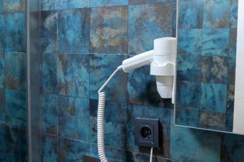 a shower head on a wall in a bathroom at Nova Prime in Bodrum City