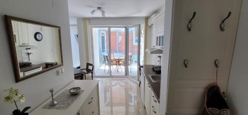 a kitchen with a sink and a counter top at Apartmani MITIĆ in Veliko Gradište
