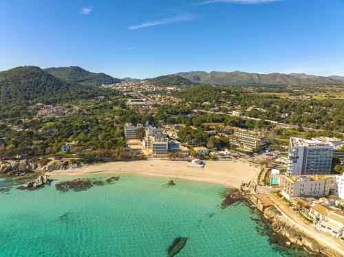 an aerial view of a beach in a city at Seafront Cala Ratjada Apartment in Cala Ratjada