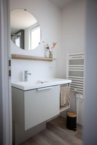 a white bathroom with a sink and a mirror at Blendin Retreat Agde in Le Grau-dʼAgde