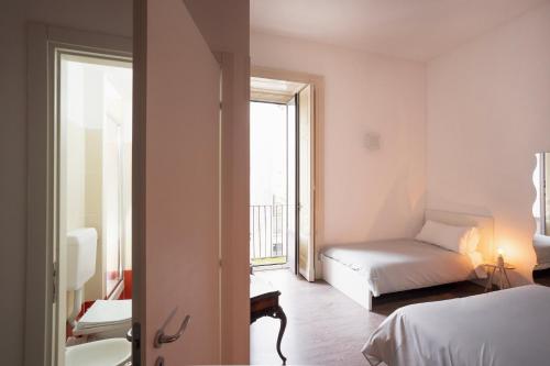 a bedroom with a bed and a window at B&B Università in Catania