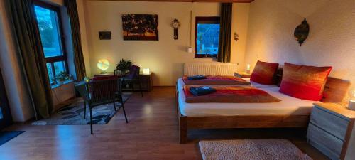 a bedroom with two beds and a desk in it at Gasthaus Zum Schneider in Pottenstein