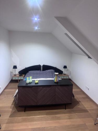 a bedroom with a bed and a staircase at logies 2460 in Kasterlee