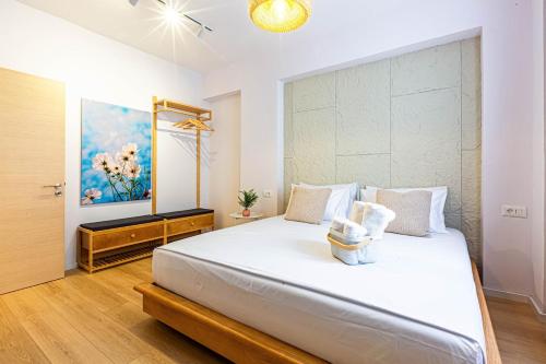a bedroom with a large white bed in a room at Dhermi's Icon Big 1BR Apt 9 in Dhërmi