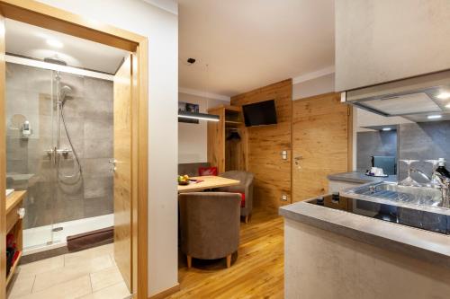 a bathroom with a shower and a sink at Genusshotel Hohenbogen GARNI in Neukirchen beim Heiligen Blut