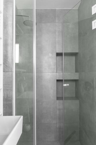a shower with a glass door in a bathroom at Twiins Studios by halu! - Next to Kallithea Beach in Kallithea Halkidikis