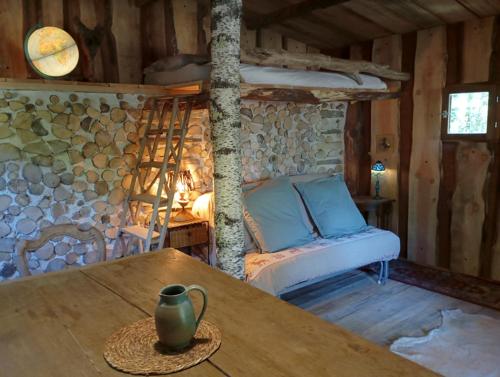 a living room with a couch and a table at Les Tramois in Donzy