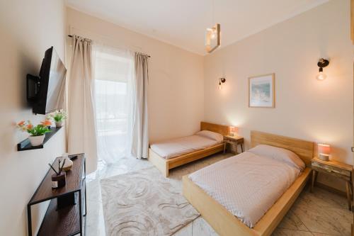 a small bedroom with a bed and a tv at Guest House Michele in Orvieto Scalo