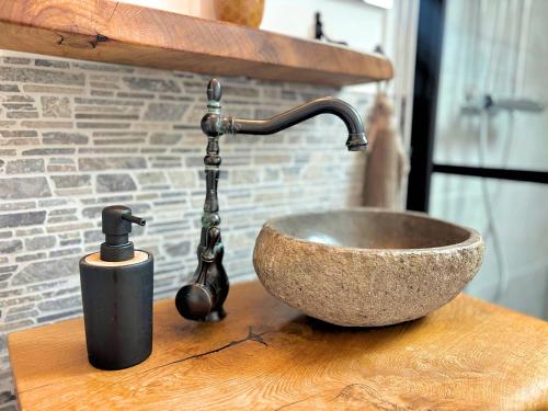 a sink with a faucet on top of a counter at Hus Gillberga in Varmlands Nysater