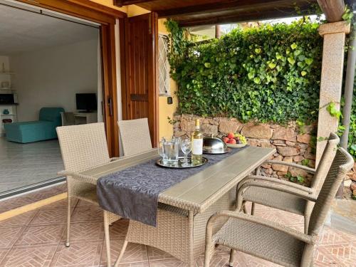 a table and chairs on a patio at Sardinia Re - Grecale 39 in Porto Rotondo
