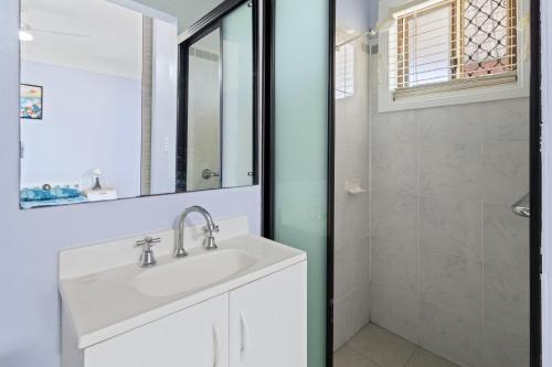 a bathroom with a sink and a shower at Sunset Nest No 1 in Sanctuary Point
