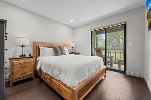 a bedroom with a large bed and a window at Flatirons Hideaway in Boulder CO in Boulder