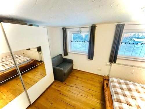 a room with two bunk beds and a couch at Ferienwohnung Kleinwalsertal in Hirschegg