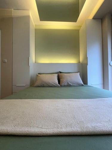a bedroom with a large bed with at Zen Apartment in Kumanovo