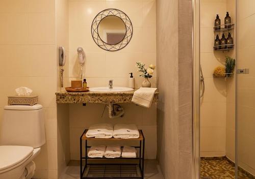 a bathroom with a sink and a toilet at Casablanca Hotel - All Inclusive in Obzor