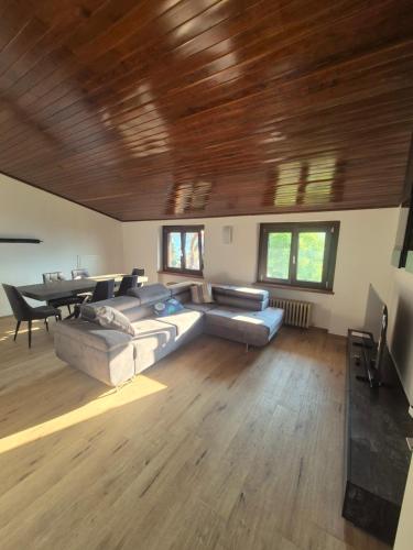a living room with a couch and a table at Luna in Lierna