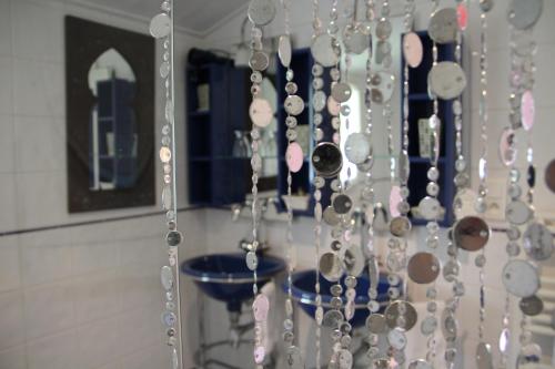 a bunch of beads are hanging on a wall at Blanc Marine in Noirmoutier-en-l'lle