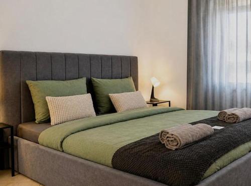 a large bed with two pillows on top of it at Holiday home Damian in Zagreb