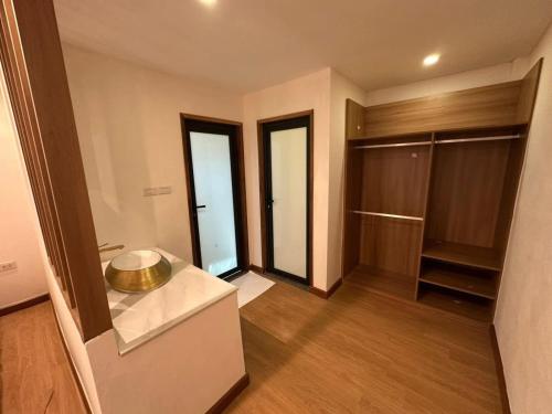 a large room with a kitchen and a walk in closet at Openview Resort Thakhek in Thakhek