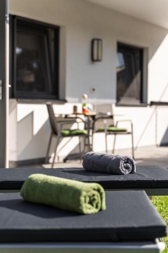 two towels are sitting on mats on a table at Apartment Zielspitz in Parcines