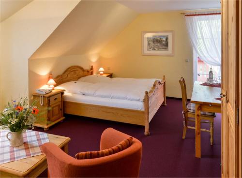 מיטה או מיטות בחדר ב-Hotel Gut Voigtlaender