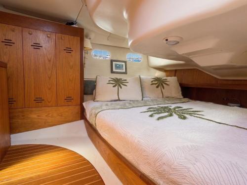 a bedroom with a bed on a boat at Elegant Sailboat Stay in Key West