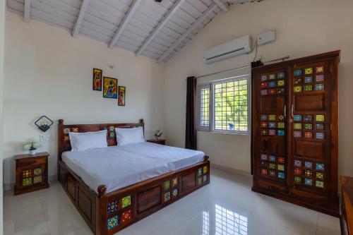 a bedroom with a large bed and a window at Vrishti Homestay in Bhīm Tāl