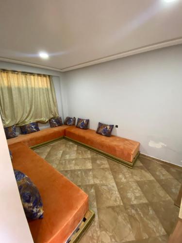 a living room with two couches in a room at La ferme labyed in Fez
