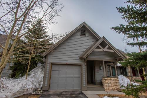 a gray house with a garage at The Woods 8 in Copper Mountain