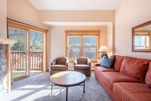 a living room with a couch and two chairs and a table at Copper Springs Lodge 426 in Copper Mountain