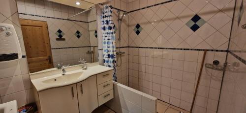 a bathroom with a sink and a shower at Cezanne in Douzains