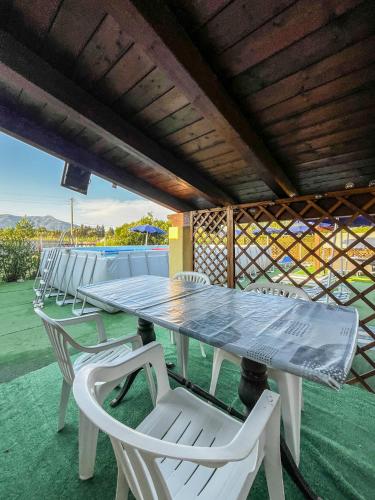 a table and chairs on the patio of a house at Casa Gli Allori in Iglesias