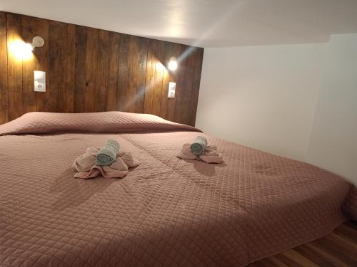 a bedroom with two towels on a bed at The Eliana Serenade in Heraklio