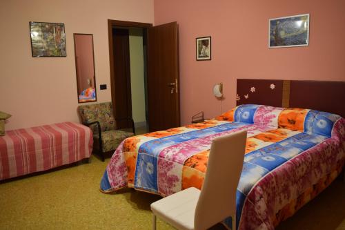 A bed or beds in a room at L'Aquilone B&B