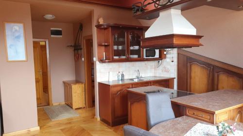 a kitchen with a sink and a counter top at Penzión U Jakuba in Kežmarok