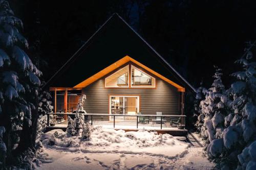 a small house in the snow at night at Swiss Marmot in Glacier