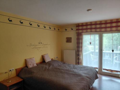 a bedroom with a bed with stars on the wall at Apartment 35, 36 Christopherhof Grafenwiesen in Grafenwiesen
