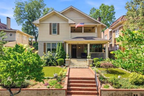 a house with an american flag on the front of it at The Classy Craftsman - Beautiful Decor & Pool in Atlanta