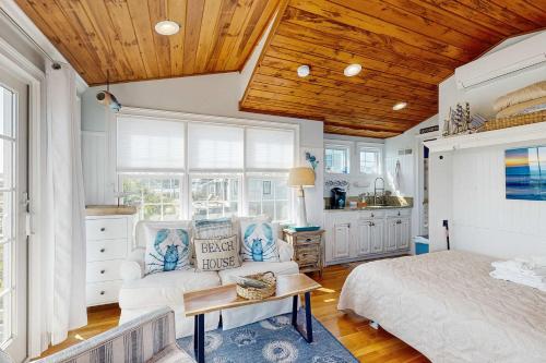 a bedroom with a bed and a table in a room at The Atlantic in Yarmouth