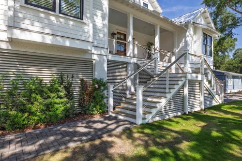 a house with a white staircase in front of it at 26th Ave 23 in Isle of Palms