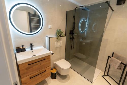 a bathroom with a sink toilet and a shower at The Nest Otočac in Otočac
