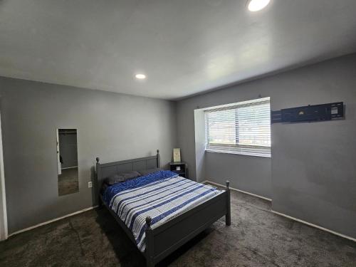 a bedroom with a bed and a window in it at Cozy place! in Baltimore
