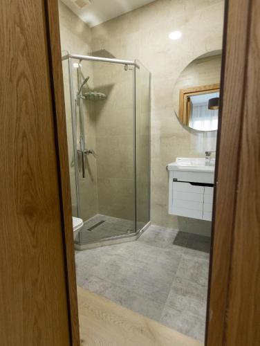 a bathroom with a shower and a sink at Mos House in Kobuleti