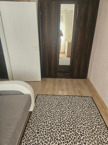 a bedroom with a bed and a mirror and a door at Laeva in Pärnu