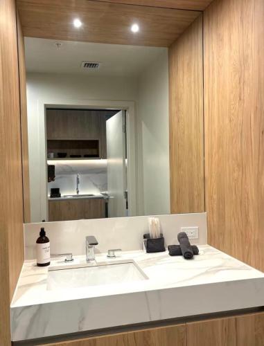 a bathroom with a sink and a mirror at C5103 Outstanding Studio in the Heart of Downtown in Miami