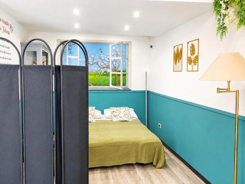 a bedroom with a bed with blue and white walls at La Casetta in Genoa