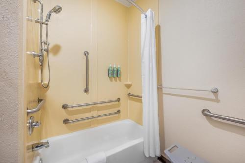 a bathroom with a shower and a bath tub at Best Western Forsyth-Decatur in Forsyth